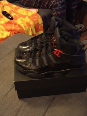 Black High-Top Sneakers with Red Accents